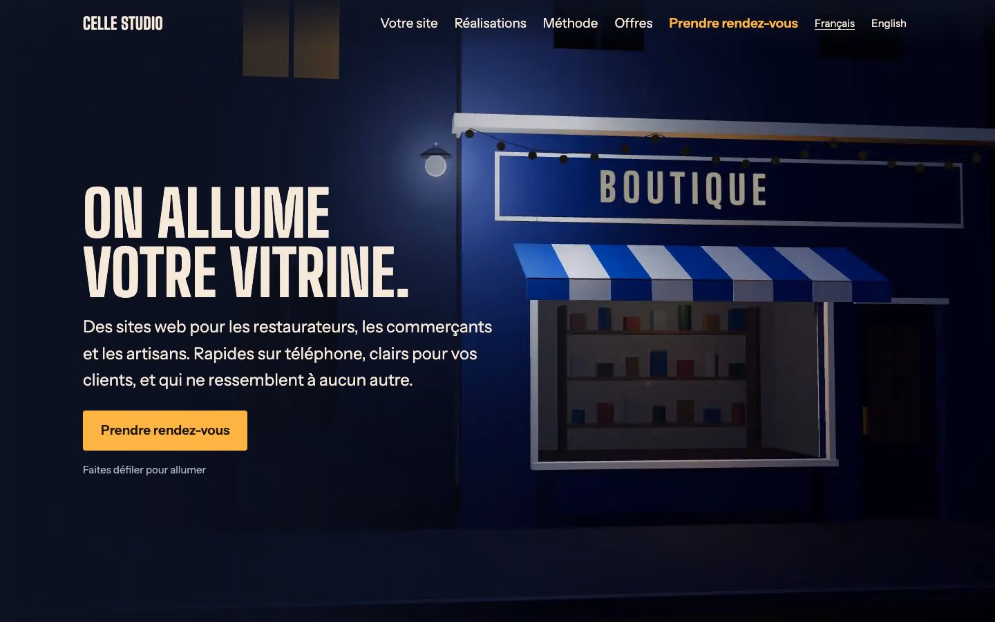 The first version of the studio's site: a shop at night and the French title “On allume votre vitrine”.